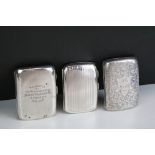Three silver cigarette cases to include a late Victorian example with engraved scrolling decoration,