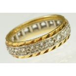 Two tone 18ct gold and white stone eternity ring. Marked 18ct to band. Size G.5.