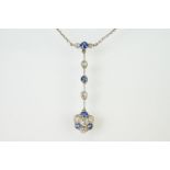 Early 20th Century Edwardian sapphire and diamond pendant necklace. The necklace having a pendant