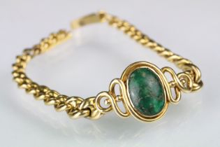 Green turquoise and gold bracelet having an oval turquoise cabochon set to the centre within a