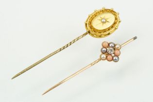 Two 19th Century stick pins to include a diamond, coral and half pearl finial pin (unmarked) and