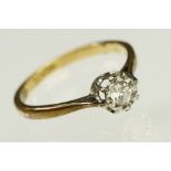 Diamond solitaire ring being set with a round brilliant cut diamond in an illusion setting,