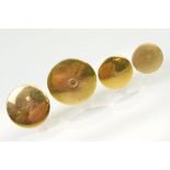 Four gold collar / dress studs of plain form. Three marked 15ct, one with rubbed mark. Largest