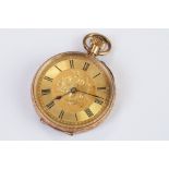 An antique 14ct gold cased top winding fob watch, roman numeral markers with golden dial, clean