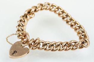 Early 20th Century 9ct gold curb link bracelet having a heart padlock clasp. Lock marked 9ct gold,