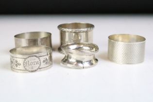Five 20th Century silver hallmarked napkin rings, the earliest dated 1919, latest 1977. All with