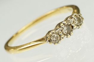 18ct yellow gold and diamond three stone ring. The ring being prong set with three round brilliant