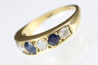 18ct gold sapphire and diamond seven stone ring set with three round cut sapphires and four round