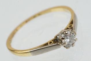 18ct gold and platinum diamond solitaire ring. The ring being set with a round brilliant cut diamond