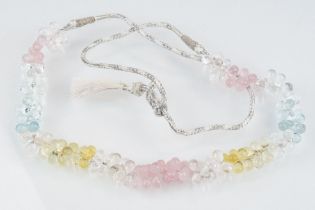 Gemstone necklace strung with pink, white, blue and yellow faceted gemstone drops including