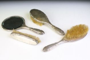 Early 20th Century silver backed dressing table set having moulded scrolled edges to each,