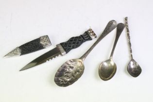 18th Century Georgian berry spoon having repousse fruit to the bowl and scrolled leaf detailing to