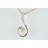 18ct gold and diamond pendant necklace. The pendant of swirl design being set with a round fancy cut