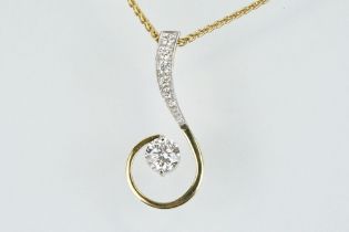 18ct gold and diamond pendant necklace. The pendant of swirl design being set with a round fancy cut