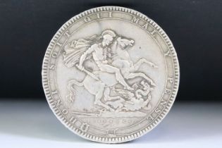 A British King George III early milled 1819 silver full crown coin.