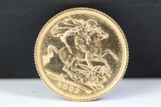 A British Queen Elizabeth II gold half sovereign coin.