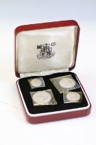 A Royal Mint 1977 Maundy Coin set in uncirculated proof condition within red display case.
