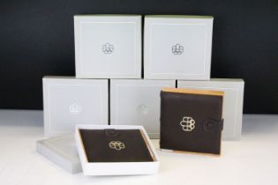 A collection of seven Canada silver proof Olympic coin sets, all within fitted display boxes and