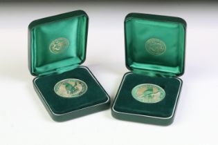 Two Australian Perth Mint 1oz fine silver 1995 Kookaburra coins within green fitted display cases.