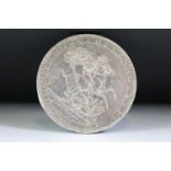 A British King George III early milled 1820 silver full crown coin.