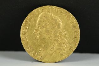A British early milled King George II 1758 gold full guinea coin.
