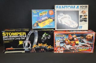 Collection of four boxed toys and games to include Matchbox Gearshift Garage Electro Service Center,