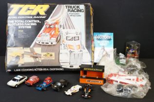 Collection of various slot cars and racing games to include Scalextric cars featuring red Mini,