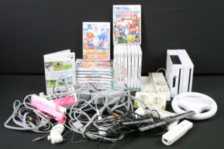 Retro Gaming - Two Nintendo Wii Consoles with 4 x Wii remotes, wires & 18 cased games to include