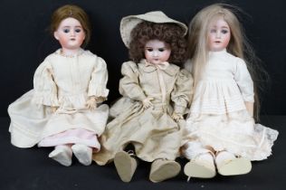 Three Late 19th / early 20th Century bisque headed dolls all having teeth and one with sleeping