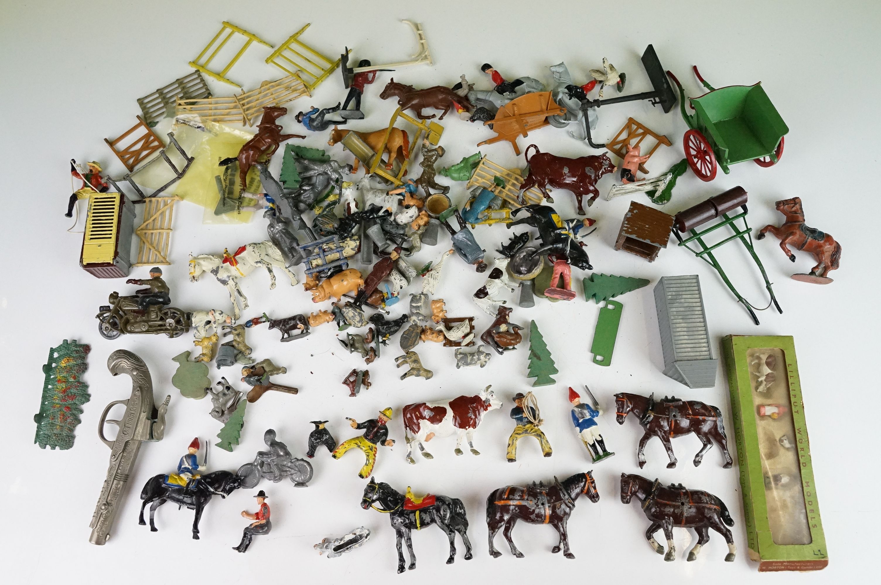 Quantity of various early-mid 20th C metal figures and accessories to include boxed Britains