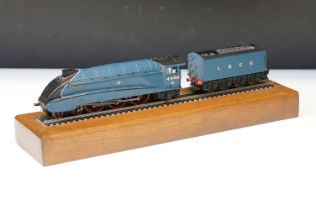 Bachmann OO gauge Mallard locomotive with tender along with a straight of track on wooden plinth for