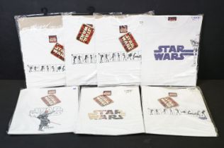 Star Wars - Seven unopened Star Wars tee shirts, sizes include 4 x Medium and 3 x Small