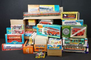26 Boxed plastic / metal Friction models featuring buses & trains, vg overall