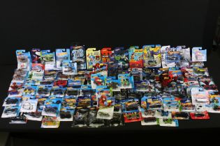 Hot Wheels - 90 Carded Hot Wheels diecast models featuring Mickey Mouse, Spider Man, Batman, Max