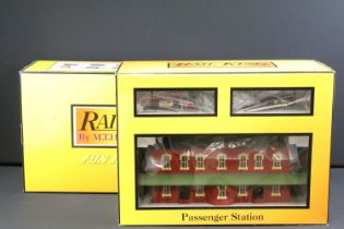 Two boxed Rail King by MTH Electric Trains trackside buildings to include 30-90425 Engine Shed and