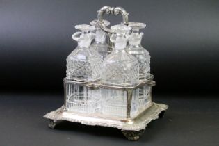 Late 19th / early 20th C set of four cut glass decanters & stoppers raised on a silver plated