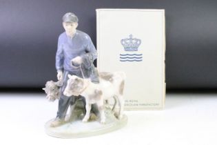 Royal Copenhagen porcelain figure group in modelled as a boy with two calves, numbered 1858,