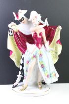 Mid 20th Century Royal Dux carnival figure group depicting a couple dressed for carnival with hand