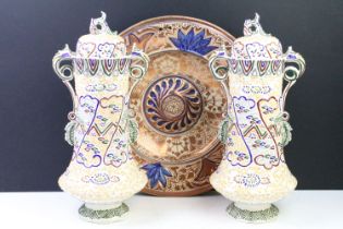 Pair of ceramic twin handled vases with lids to top having tube lined decoration throughout together