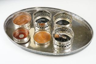 A large silver plated serving tray with decorative pierced edge together with a collection of silver
