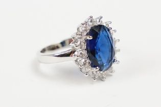 A 925 sterling silver ladies dress ring of classical style with oval blue centre stone, marked 925
