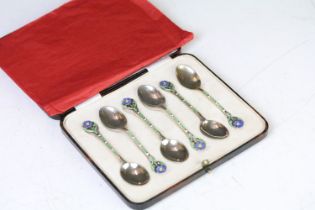 A cased set of six fully hallmarked sterling silver and enamel teaspoons, floral patterned finials