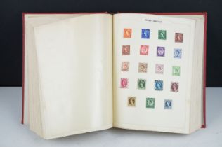 A collection of British, Commonwealth and world stamps contained within a red simplex album to