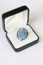 A 925 sterling silver and blue enamel pin brooch in the Art Nouveau style with bell flower