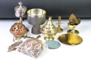 A small collection of religious items to include a crucifix, candlesticks, rosary beads....etc..