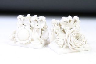 Two Belleek first period white porcelain floral encrusted menu holders with rose and sunflower