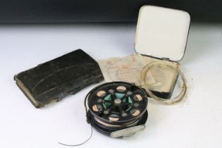 Allcocks fly fishing reel together with a tin of assorted fishing line and a fly fishers companion