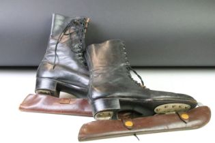 Pair of Stille Swedish black leather lace up ice skates complete with fitted blade sheaths. Measures