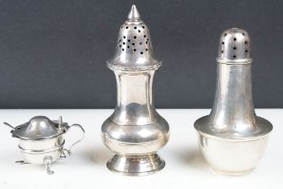 A fully hallmarked sterling silver sugar shakers together with a silver plated examples and a