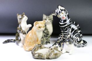 Five Winstanley ceramic studio pottery cats each with yellow glass eyes, together with an Italian